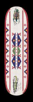 A long, oval beaded object with geometric blue, red, and green designs on a white background. There are two detailed lizard-like creatures at opposite ends. The border is red with white rectangles.