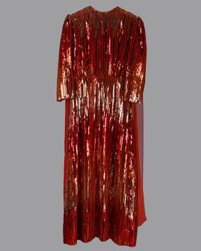 A long, ankle-length red dress with three-quarter sleeves, covered in shiny sequins arranged in vertical lines, displayed against a plain gray background.
