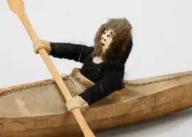 toy kayak with figure paddling