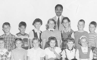 black and white school class picture with Mervyn M. Dymally as teacher standing behind his students