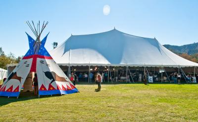 tipi and festival tent on lawn