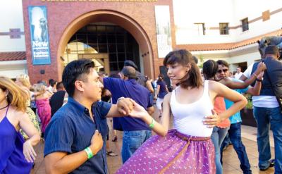 couple dancing in the Autry Plaza