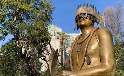 Statue of a Native leader in a city center