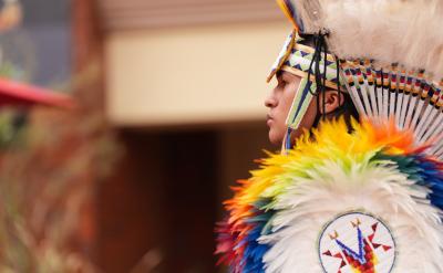 Profile of a Native man dressed in regalia 