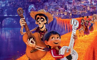 A boy and a skeleton, both holding guitars, stand on a glowing orange bridge, with a vibrant city and festive characters in the background. The scene is colorful and lively, inspired by Día de los Muertos.