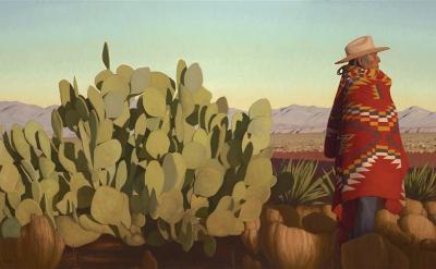 A person wearing a wide-brimmed hat and a red patterned blanket stands beside a large prickly pear cactus in a desert landscape, with distant mountains under a clear sky.