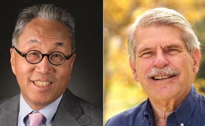 Side-by-side portraits of two older men: one with gray hair, glasses, and a suit, smiling in front of a dark background; the other with gray hair, a mustache, and a blue shirt, smiling outdoors.
