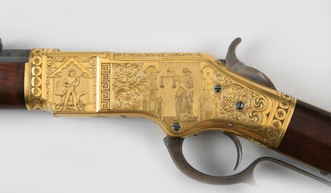 detail of a gold-plated rifle