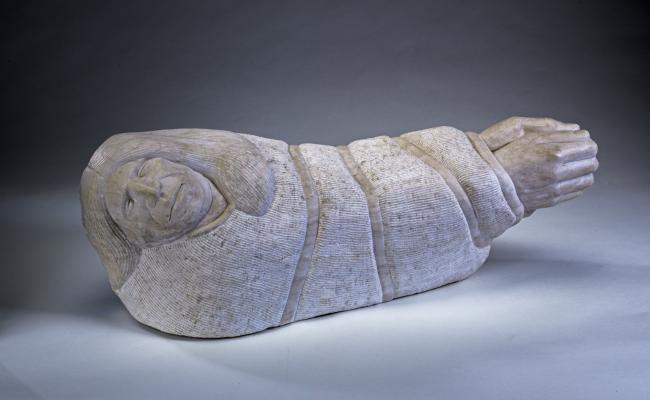 sculpture of a bound native american