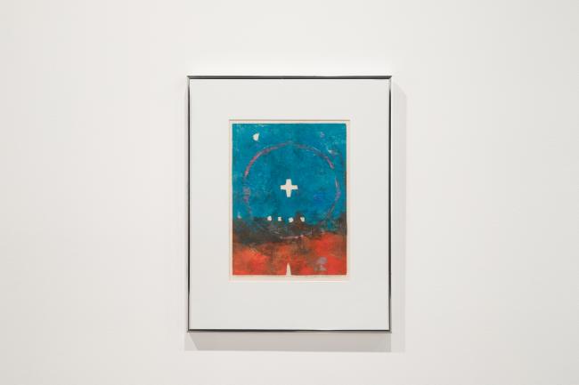 an abstract painting with a small cross at its center