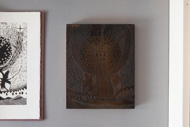 a carved wooden block used for printing