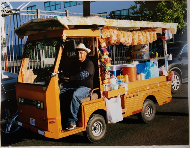 a man drives a small snack van