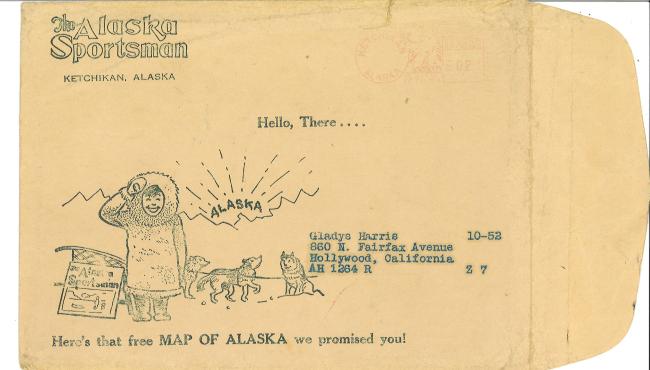 envelope addressed to send decorated with drawing of person in winter clothes and dogs with sled from Alaska