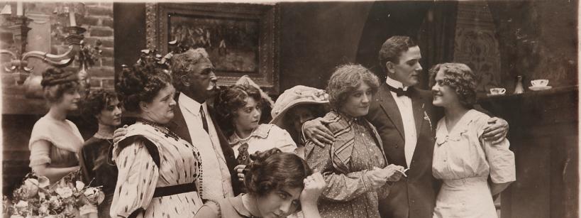 a group of people dressed in formal wear at a gathering