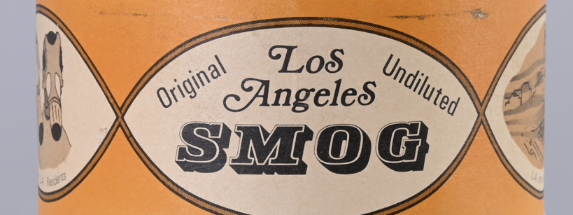 A cylindrical tin can labeled "Los Angeles Original Undiluted SMOG" with vintage-style graphics and an orange background.