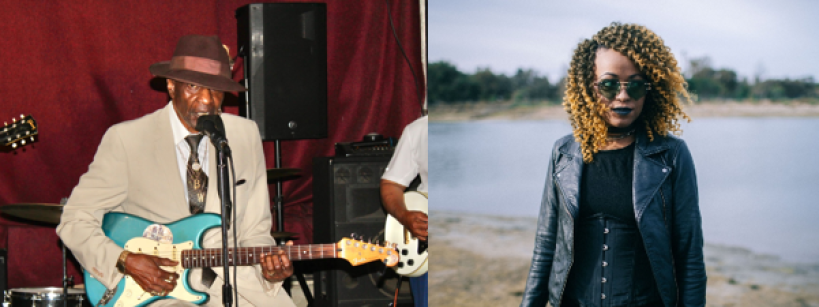 A man in a suit and hat plays an electric guitar and sings into a microphone on stage; beside him, a woman with curly hair wearing sunglasses, a black dress, and a leather jacket stands outdoors by water.