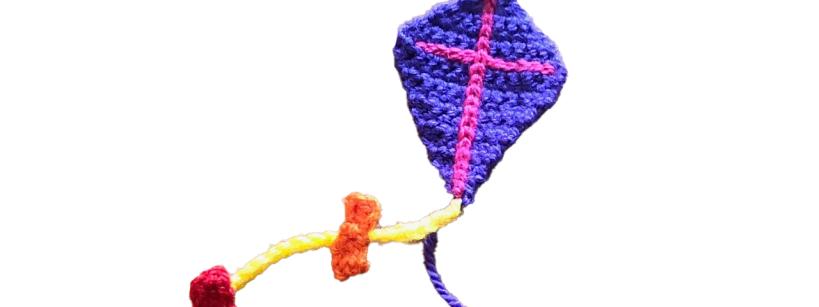 crochet kite made with purple and pink yarn