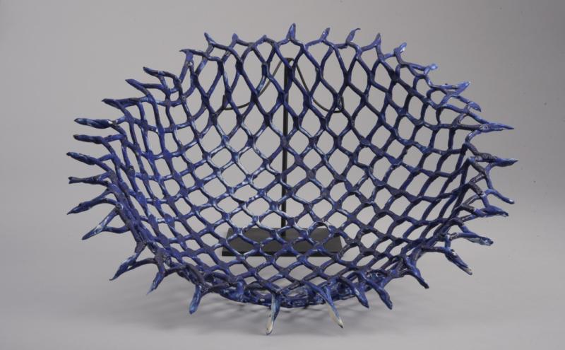 A netlike blue ceramic sculpture