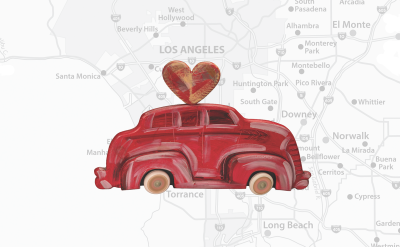 A painted red vintage car with a heart on its roof is centered over a faded map of Los Angeles and its surrounding areas.
