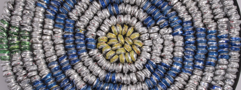 flattened soda cans arranged in a spiral