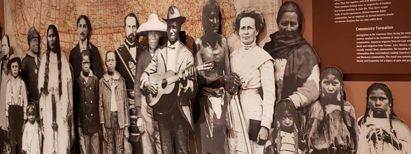 cardboard cutout of diverse individuals from the American West in the 19th century