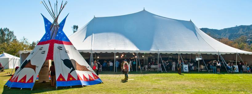 tipi and festival tent on lawn